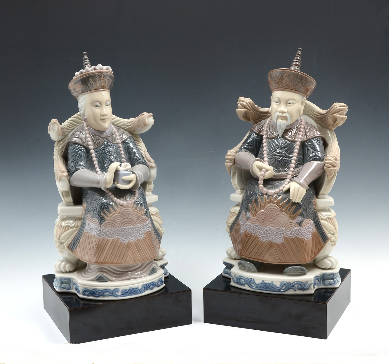 Appraisal: PC LLADRO EMPEROR EMPRESS Lladro figures of a seated Chinese