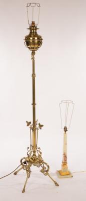 Appraisal: A brass telescopic standard lamp on four splay hoof feet