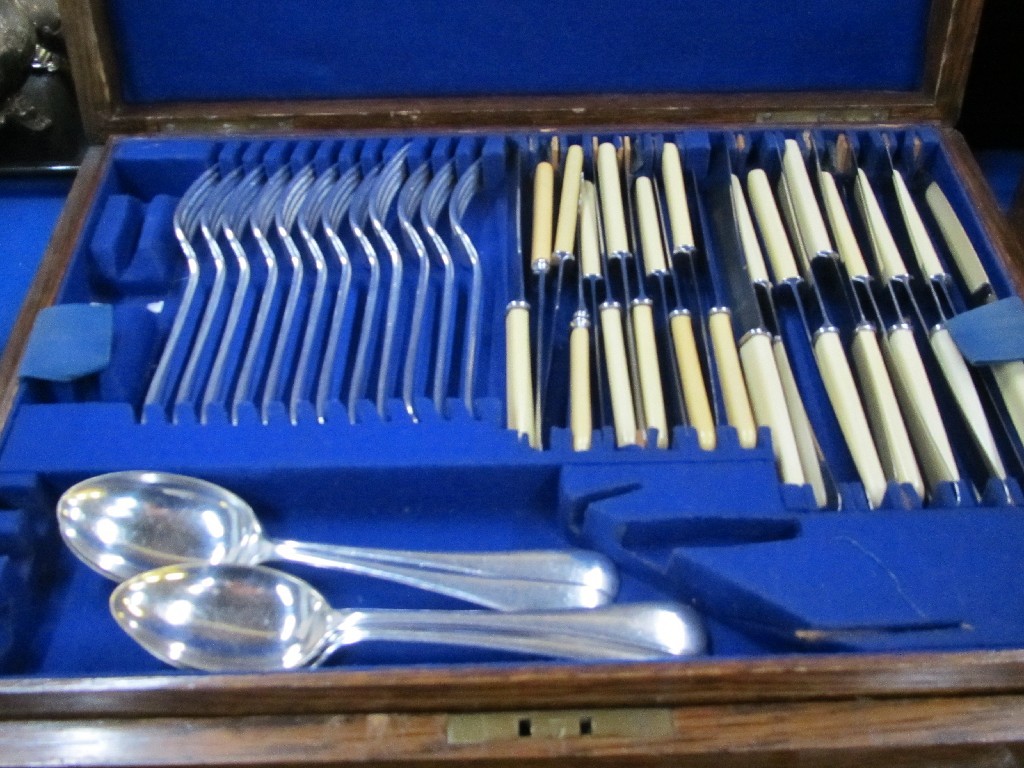 Appraisal: Oak part canteen of cutlery