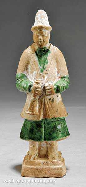 Appraisal: A Chinese Partial Green Glazed Pottery Figure Ming Dynasty -