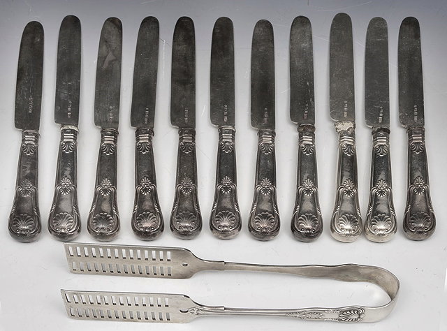 Appraisal: A SET OF ELEVEN SILVER KNIVES with embossed shell handles