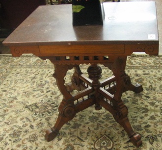 Appraisal: A VICTORIAN MARBLE-TOPPED WALNUT LAMP TABLE Eastlake design American c