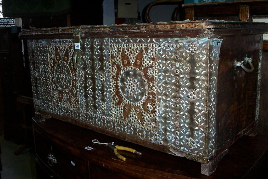 Appraisal: A Zanzibar coffer extensively overlaid with beaten brassware -