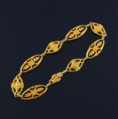 Appraisal: A French gold bracelet c of eight pierced foliate links