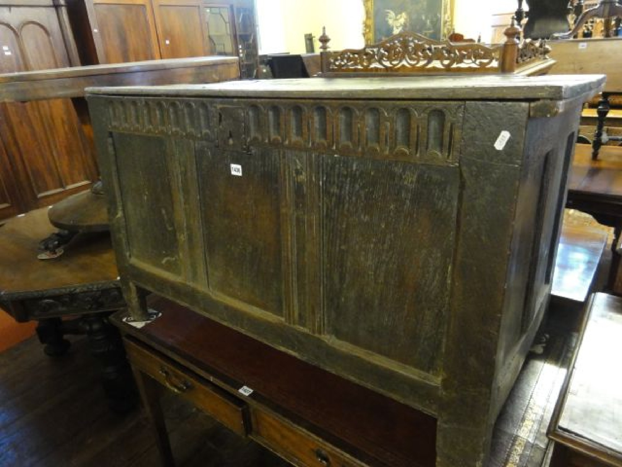 Appraisal: An th century oak coffer with hinged lid and panelled