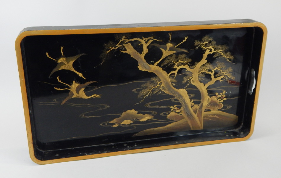 Appraisal: An oriental black lacquer tray decorated in gilt with cranes