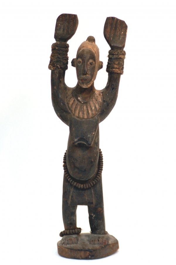 Appraisal: Dogan Tintam female figure of dark finished wood with typical