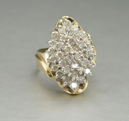 Appraisal: DIAMOND CLUSTER RING K yellow gold diamond ring contains round