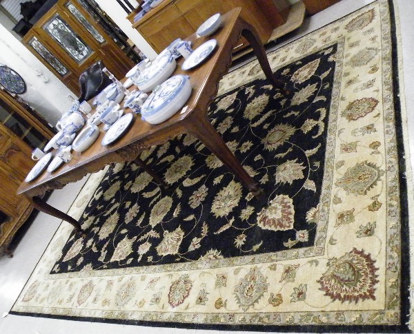 Appraisal: HAND KNOTTED ORIENTAL CARPET Pakistani-Persian scrolling floral receme design on