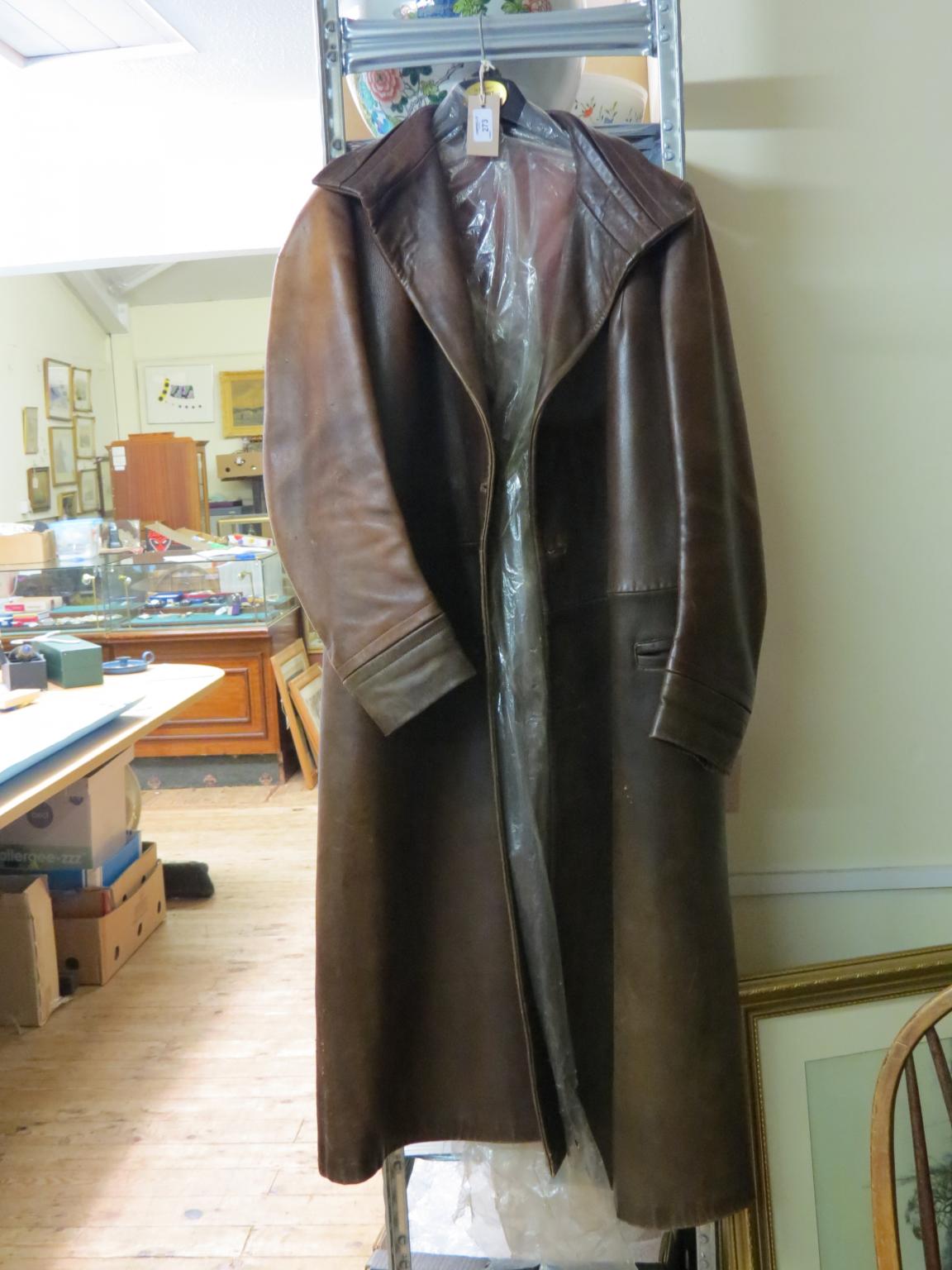 Appraisal: A gentleman's full-length leather coat and three gentleman's hats contained