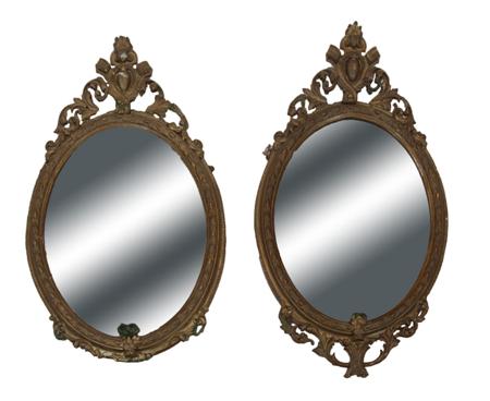 Appraisal: A pair of th century giltwood oval wall mirrors the