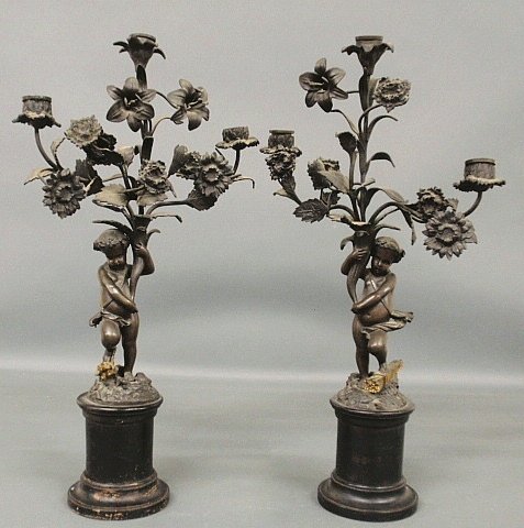 Appraisal: - Pair of French bronze candelabra th c with cherubs