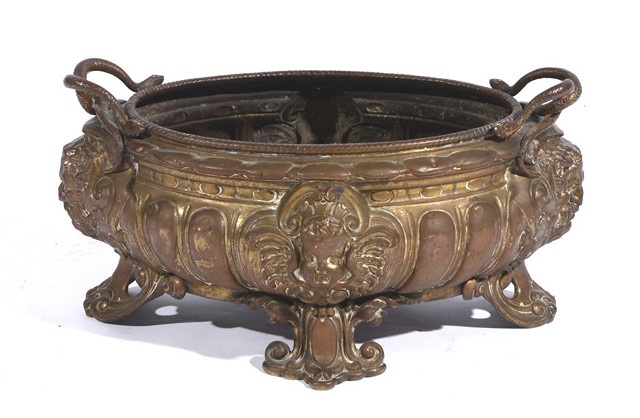 Appraisal: AN EMBOSSED OVAL JARDINIERE with snake handles and mask head