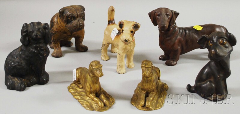 Appraisal: Six Painted Cast Iron Dog Doorstops and a Dachshund Bank