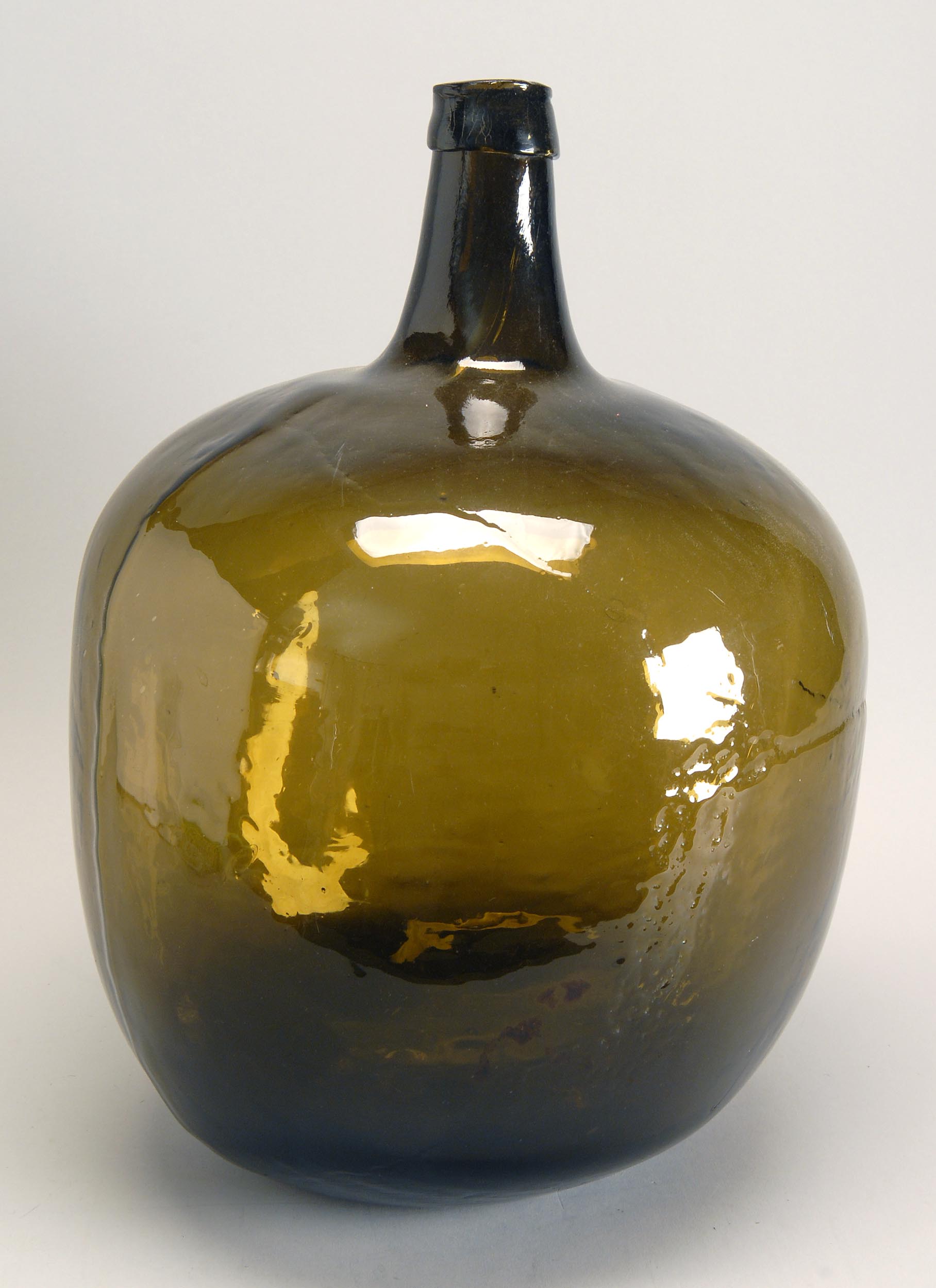 Appraisal: TH CENTURY FREE BLOWN GLASS DEMIJOHN in dark amber With