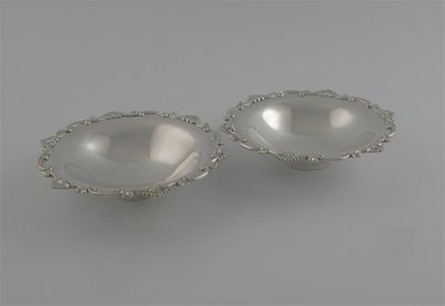 Appraisal: A pair of modern sweetmeat dishes shaped outline raised foot