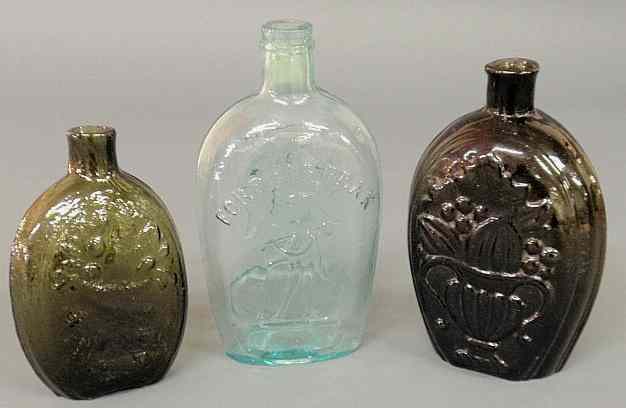 Appraisal: Three early blown glass flasks two with potted flowers and