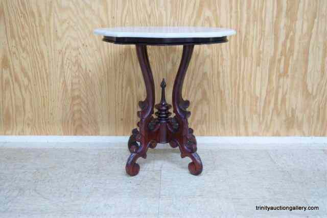 Appraisal: Mahogany Marble Top Side Table With scrolled legs and Duncan