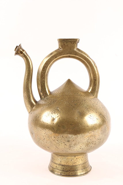 Appraisal: AN INDO-PERSIAN BRONZE EWER th th Century of onion form