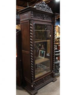 Appraisal: Continental carved oak single door vitrine th century the central