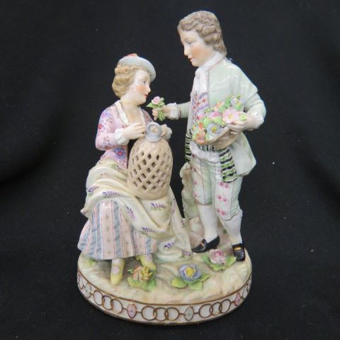 Appraisal: German Porcelain Figurine with a Couple her with bird cage