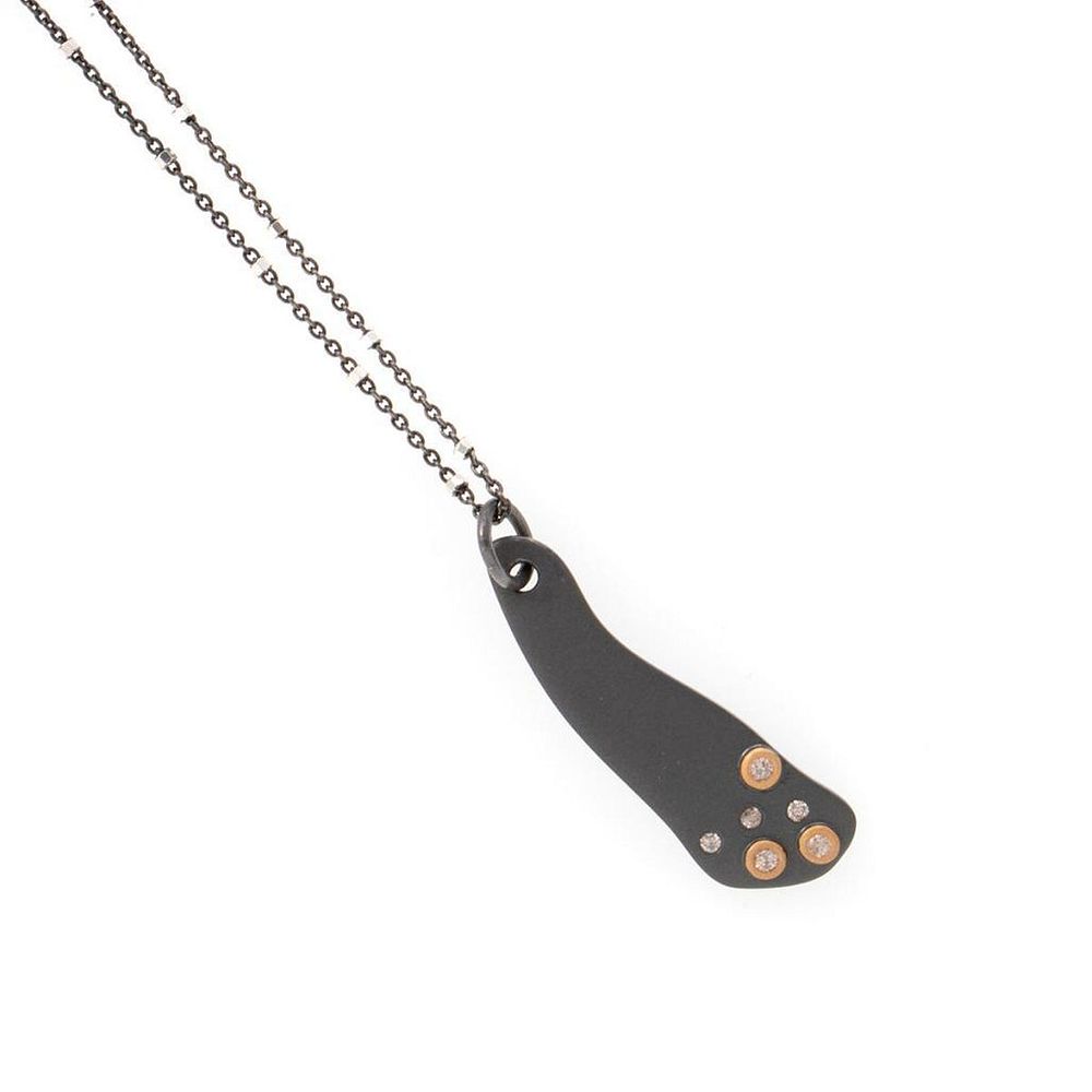 Appraisal: Diamond blackened silver k gold pendant chain set with round