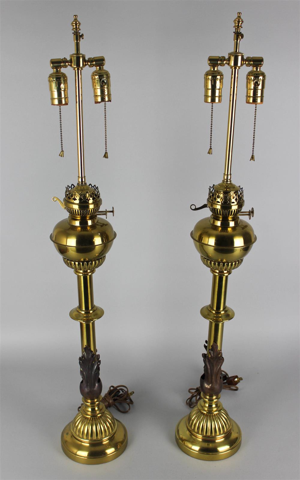 Appraisal: PAIR OF ENGLISH NEOCLASSICAL STYLE PATINATED METAL MOUNTED BRASS CONVERTED