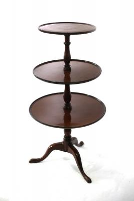 Appraisal: A George III mahogany three-tier dumb waiter on baluster turned