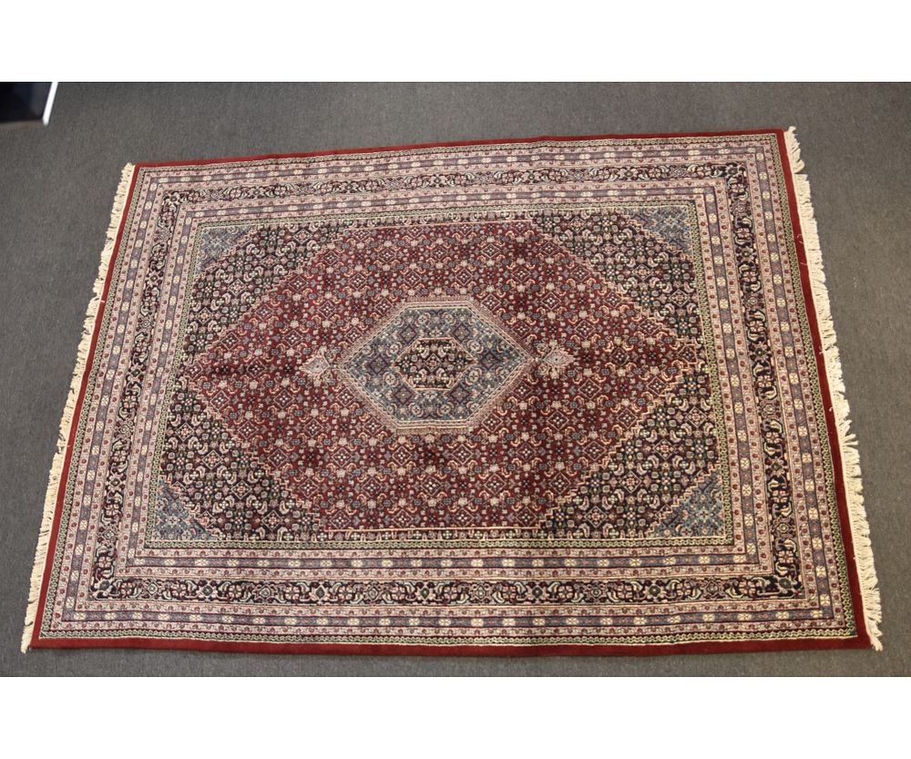 Appraisal: Persian Roomsize Carpet Persian roomsize carpet with blue diamond center