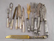 Appraisal: A silver pickled onion lifter together with five silver knives