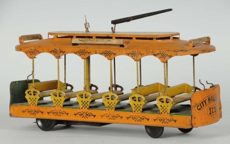 Appraisal: Pressed Steel City Hall Park Trolley Wind-Up Toy Description Working