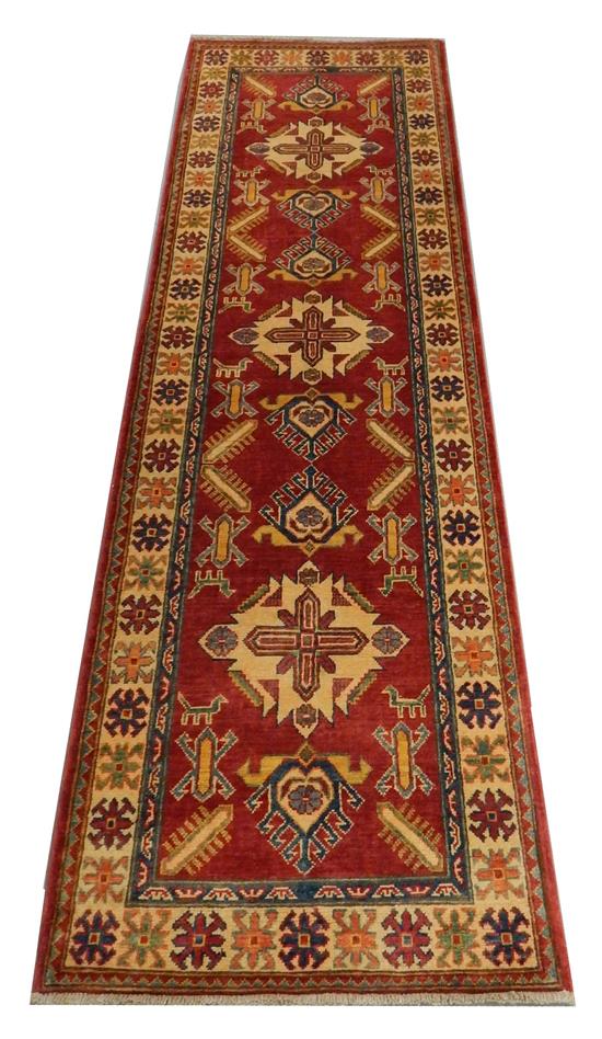 Appraisal: RUG Uzbek Kazak runner '' x '' red field cream