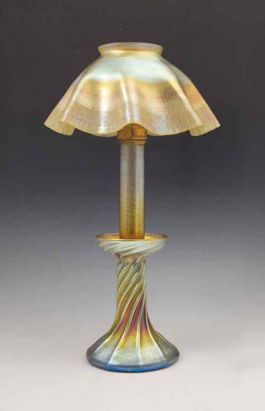 Appraisal: TIFFANY FAVRILE GLASS CANDLE LAMP Swirled base signed LCT Ruffle