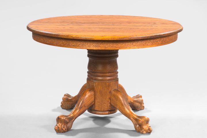 Appraisal: American Late Victorian-Style Oak Circular Dining Table the circular top