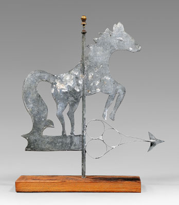 Appraisal: Rearing horse-form weathervane standing on arrow-form directional galvanized tin with