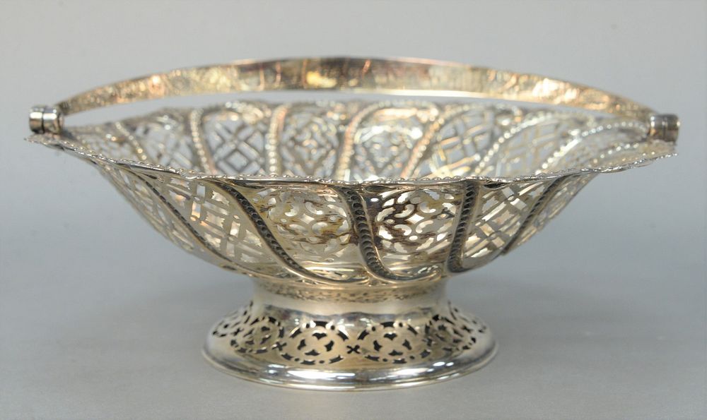 Appraisal: English Silver Reticulated Basket with swing handle height with handle