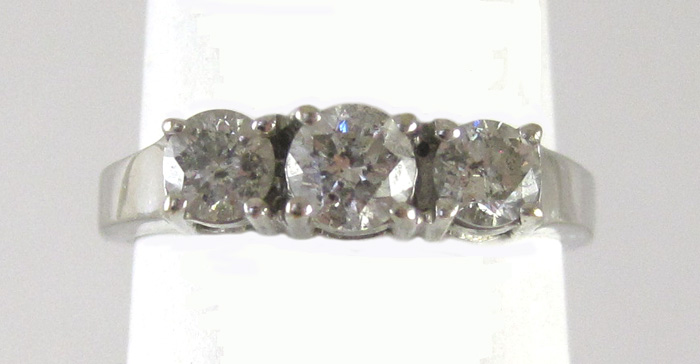 Appraisal: DIAMOND AND FOURTEEN KARAT WHITE GOLD RING set with three