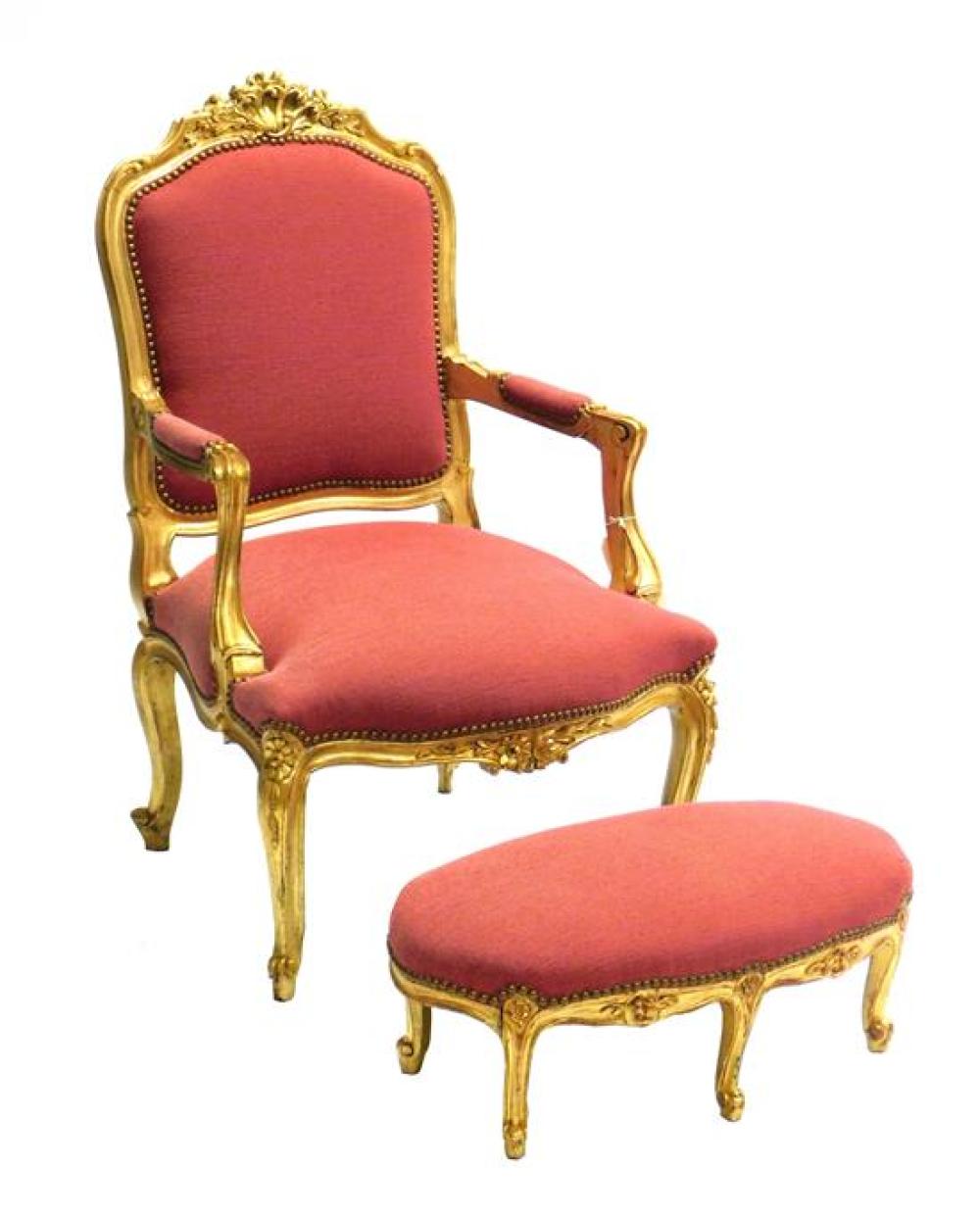 Appraisal: Louis XV style upholstered armchair and matching footstool ornately carved