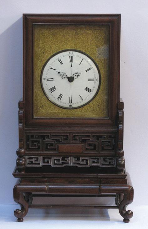 Appraisal: AN ANGLO-CHINESE BRACKET CLOCK the circular convex dial with Roman