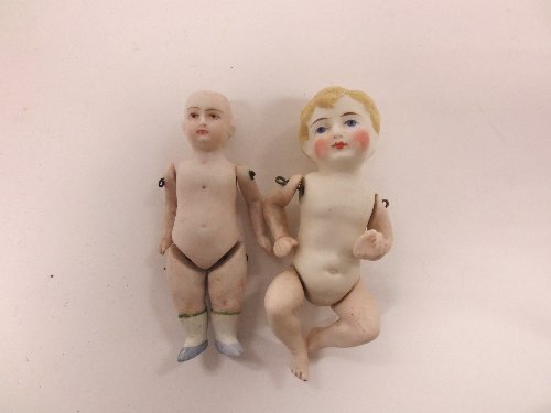 Appraisal: A bisque doll with moulded hair and swivel arms and