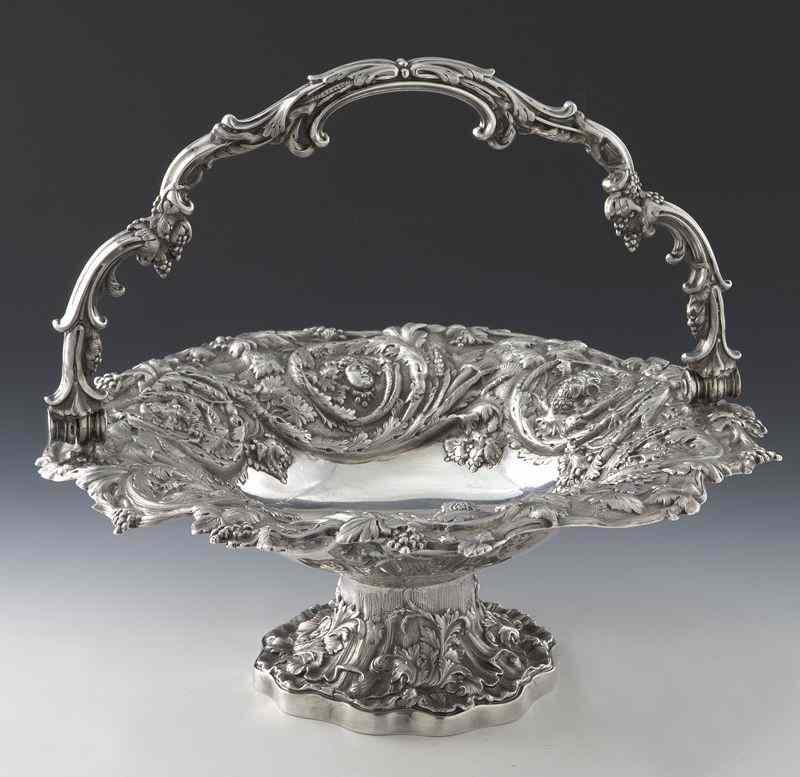 Appraisal: English sterling silver basket with handle decorated with a repousse