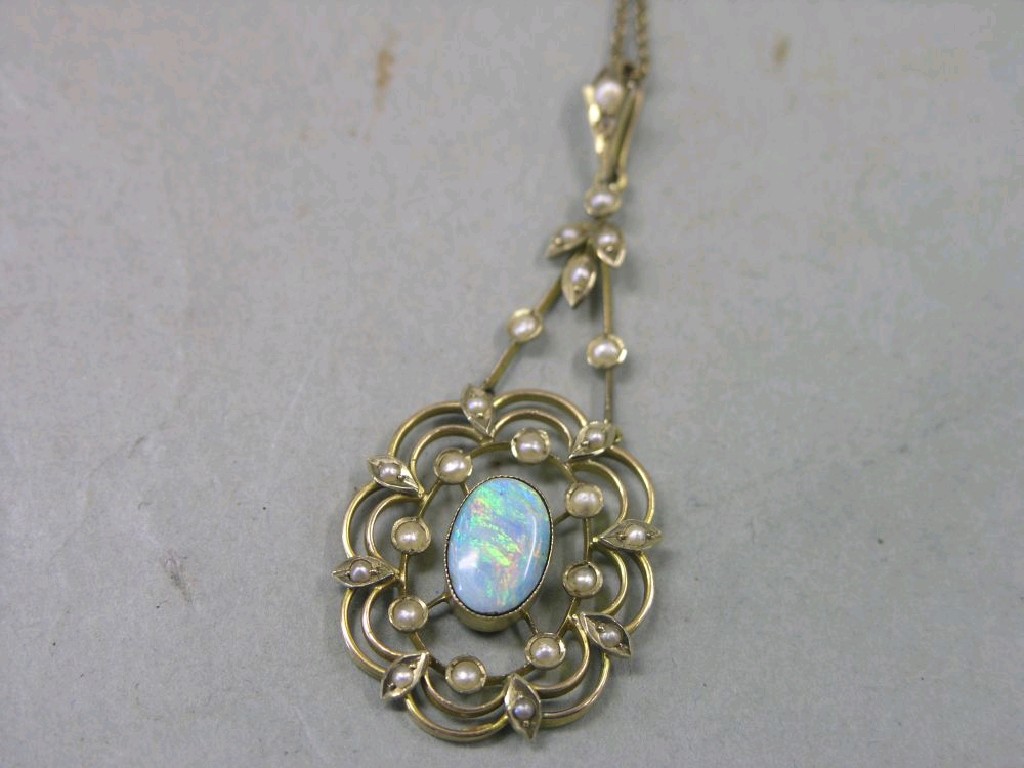 Appraisal: A Victorian gold opal and seed pearl pendant central oval