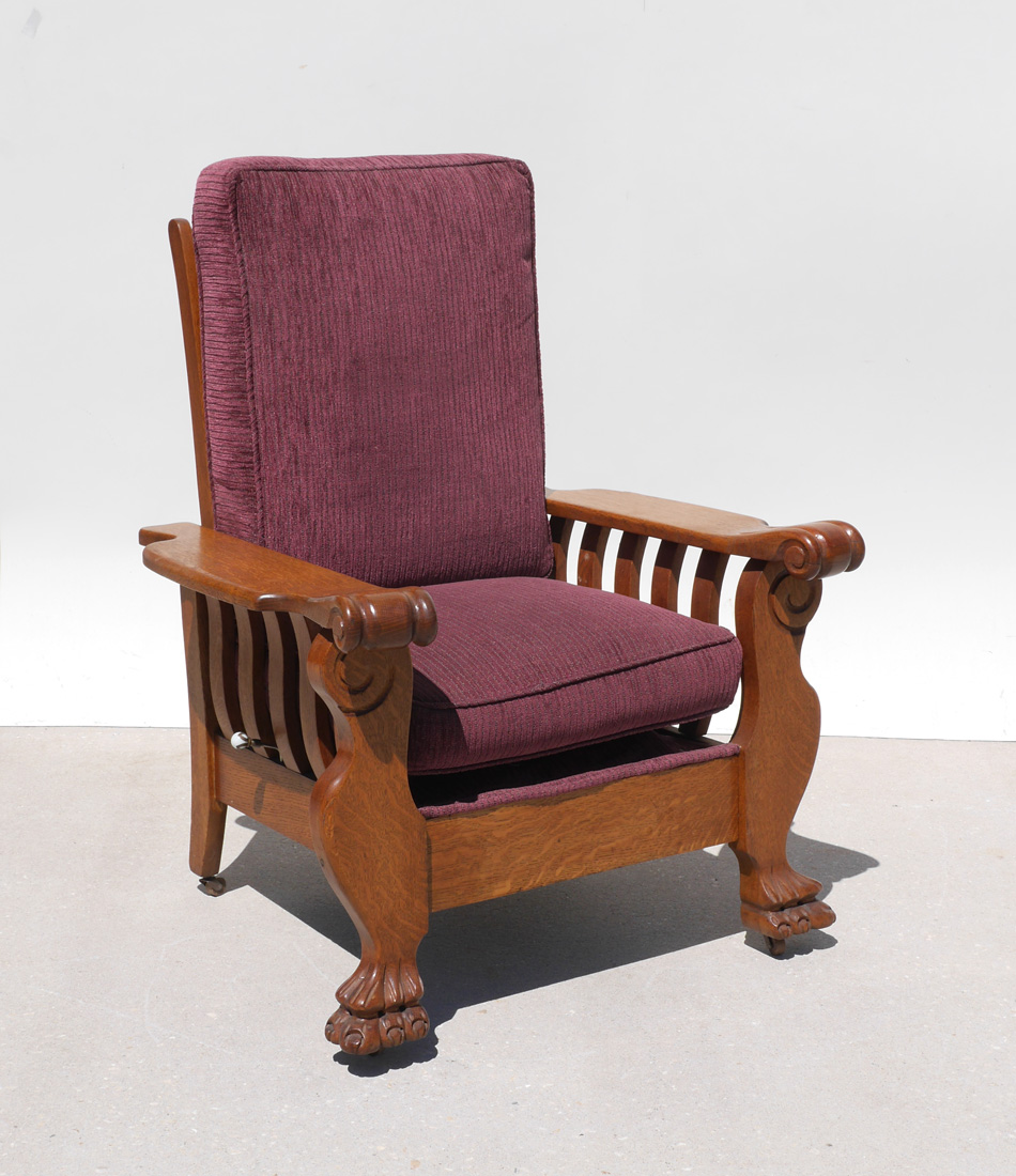 Appraisal: CARVED OAK MORRIS CHAIR Arms with shaped supports scroll carved