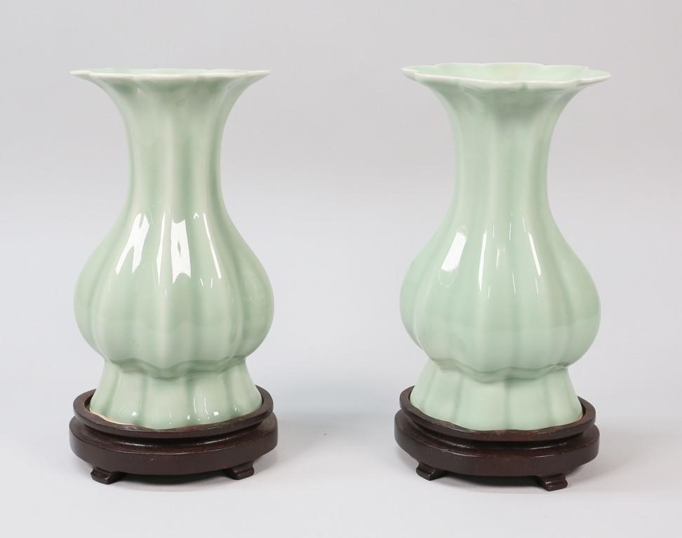 Appraisal: Pair of Chinese porcelain melon form celadon vases on wooden