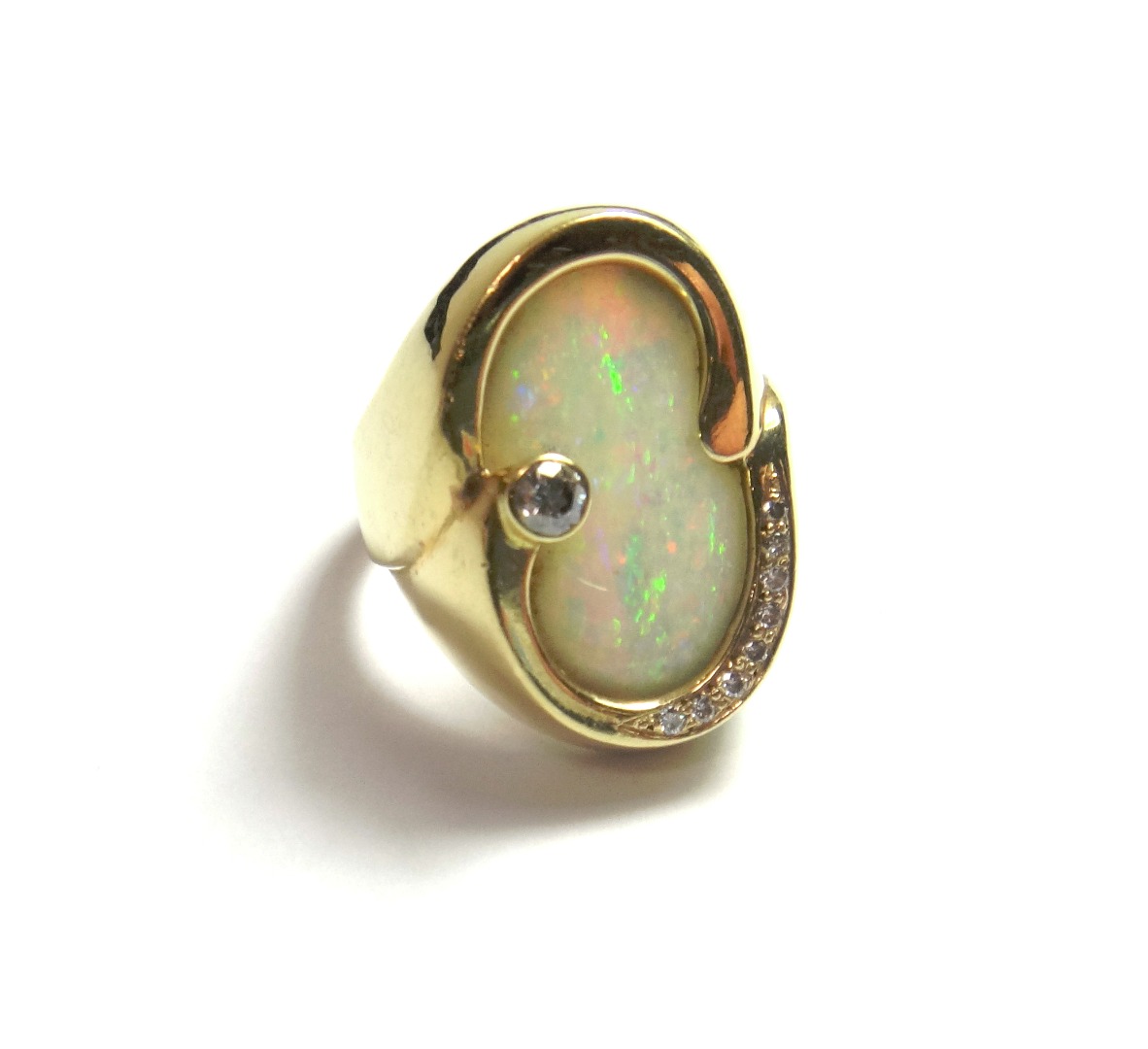 Appraisal: A gold opal and diamond set ring in an abstract