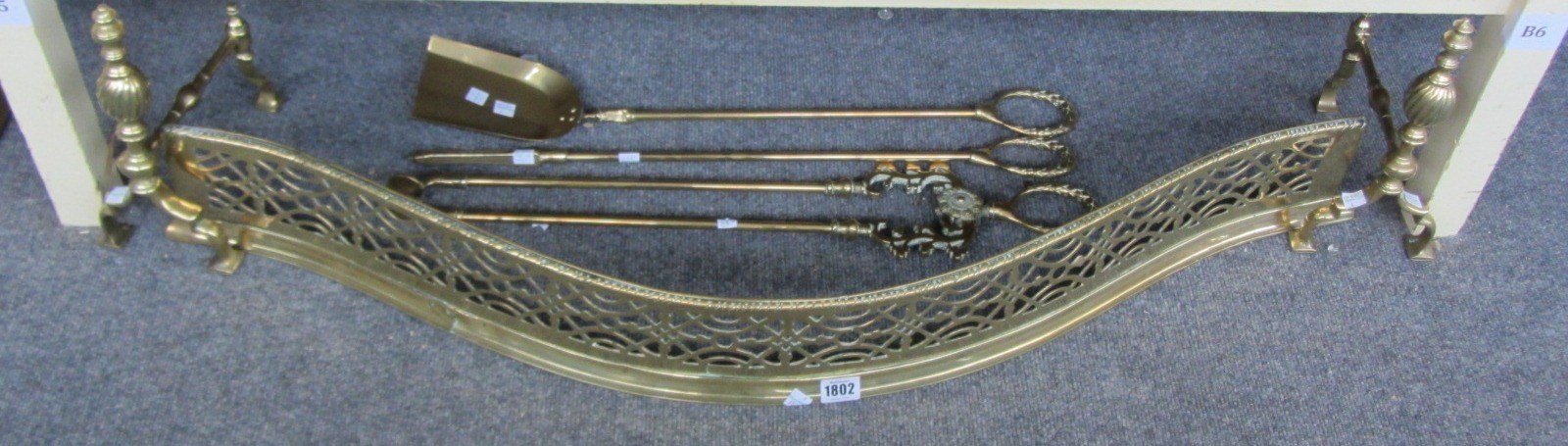 Appraisal: A set of Victorian brass fire irons with laurel wreath