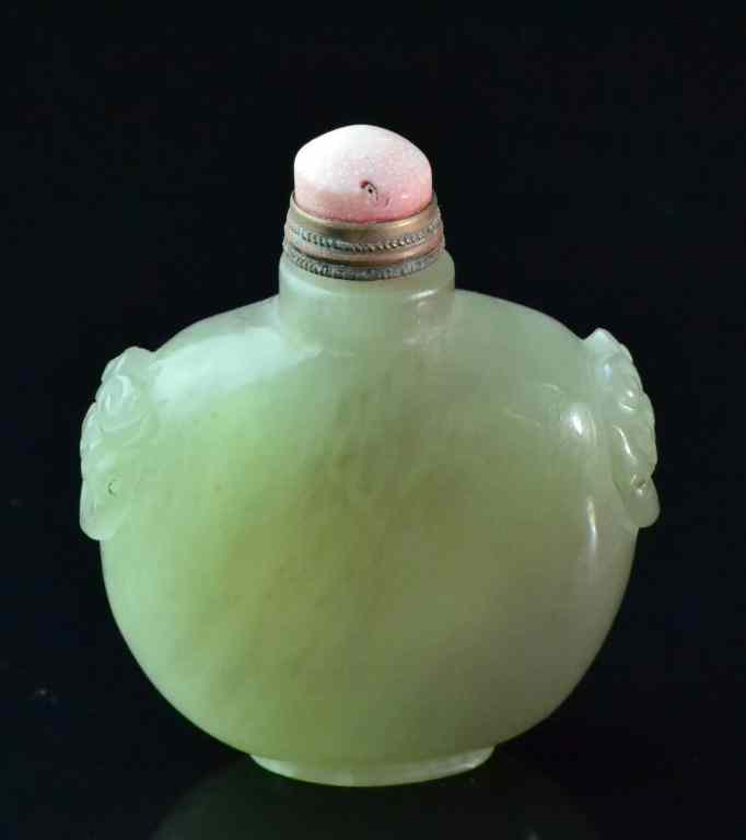 Appraisal: Chinese Qing Carved Jade Snuff BottleWith two carved dragon head