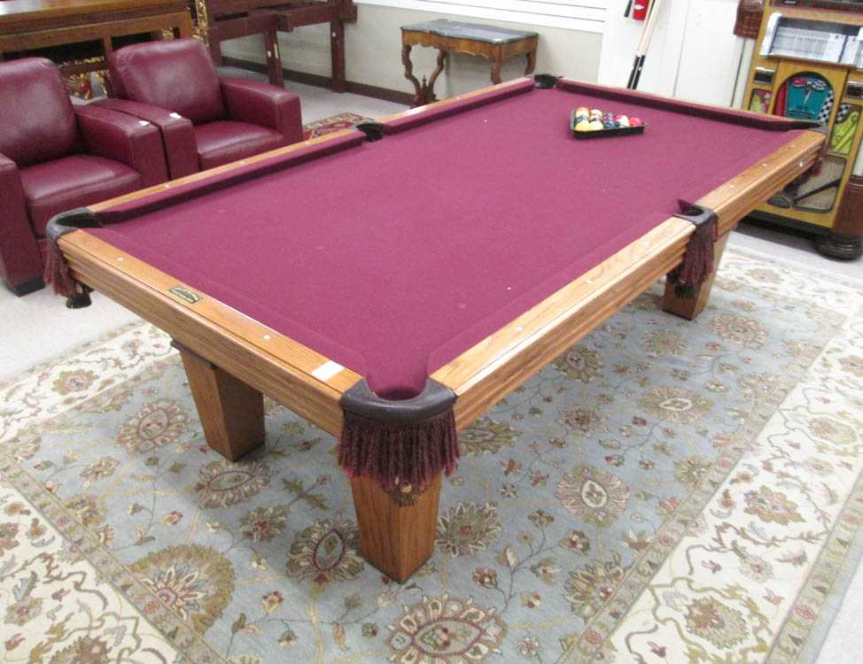 Appraisal: AN OAK POOL TABLE WITH ACCESSORIES Olhausen Pool Table Mfg