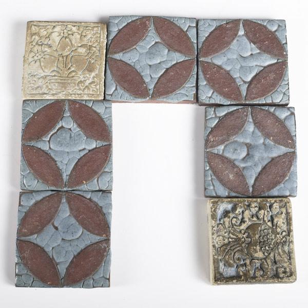 Appraisal: GRUEBY BATCHELDER Five Grueby tiles with circular decoration and leathery