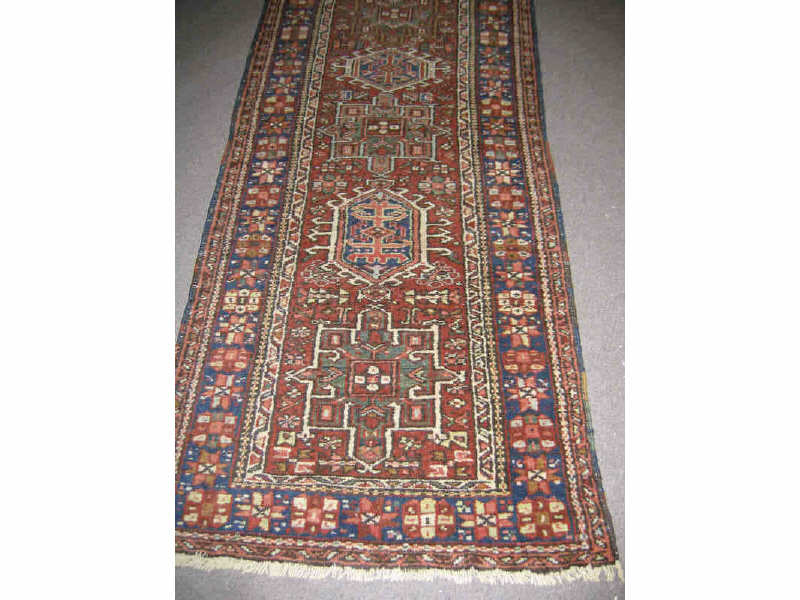 Appraisal: KARAJA RUNNER The brick red field of angular design shows